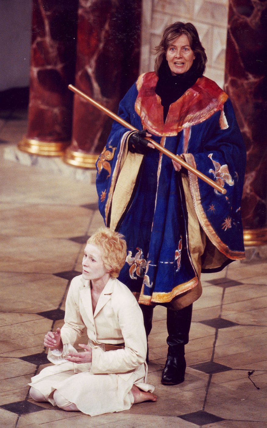 2000 The Tempest Vanessa Redgrave Prospero Donald Cooper Website A woman in a cloak holding a staff stands over a pale-faced man dressed in white.