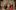 Three Sisters by Chekhov at The Globe Theatre, London, Credit: Johan Persson A group of actors, on stage, in Russian costumes, in the process of lining up to have their photo taken. They are smiling and laughing.