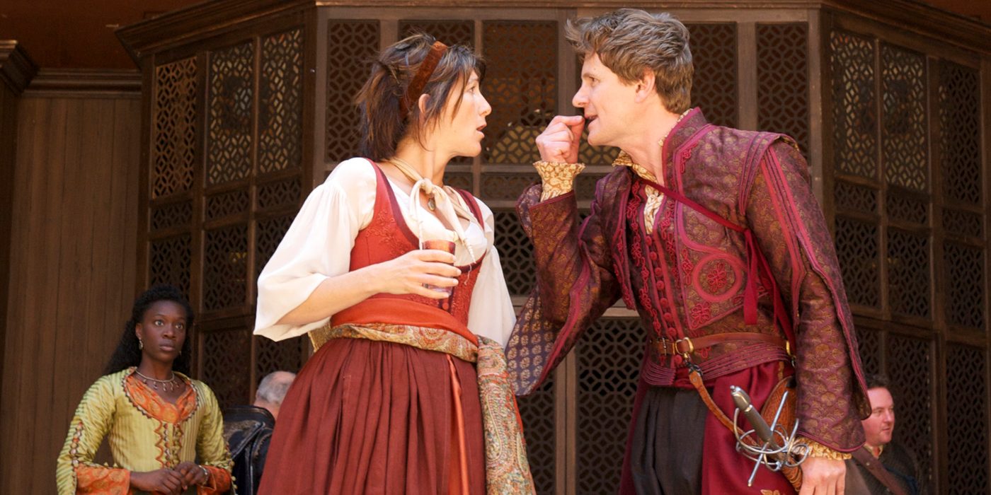 Beatrice Benedick Much Ado About Nothing 2011 Shakespeare's Globe Manuel Harlan flush A woman and a man face each other, arguing.