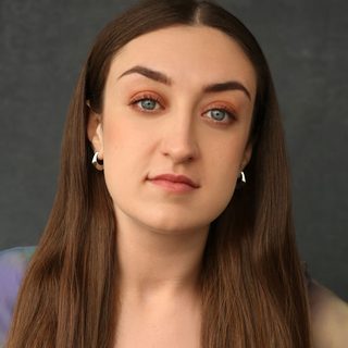 This is a headshot of Corrina Buchan looking directly to camera.