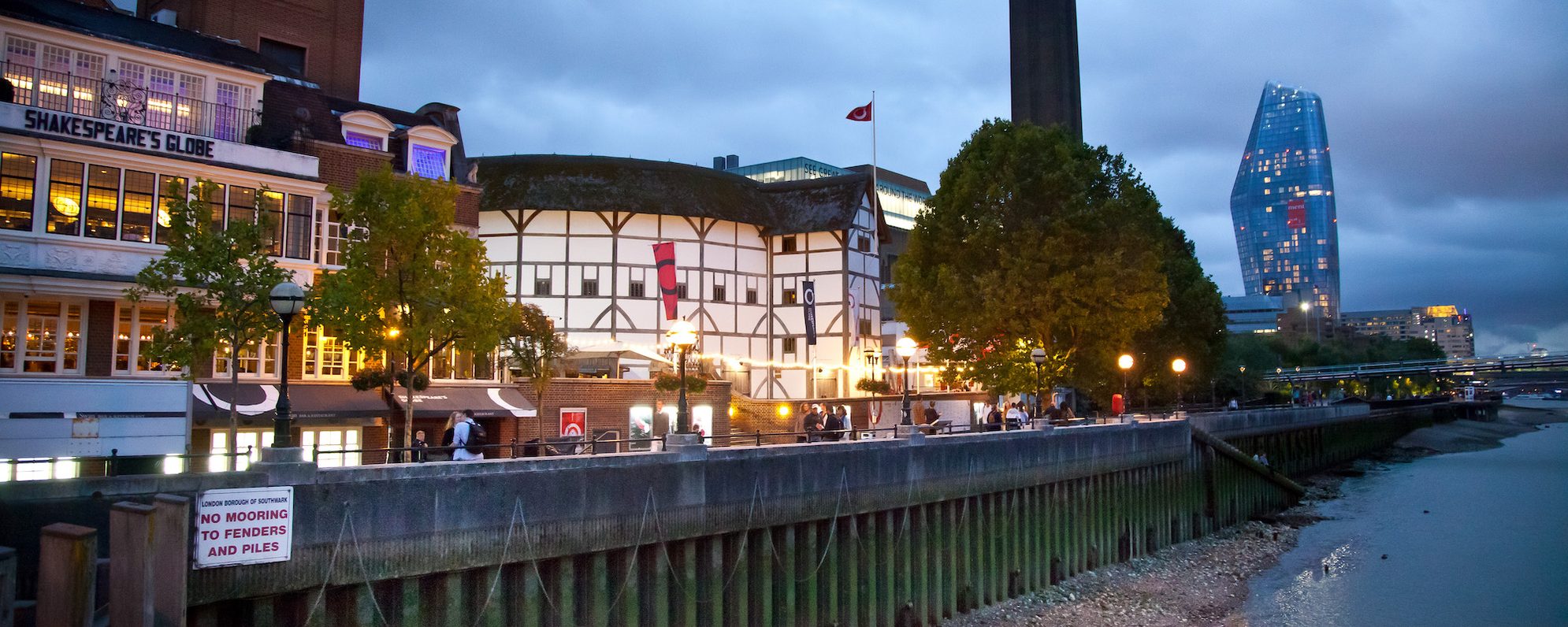Getting Here Shakespeare's Globe by the riverside at night time