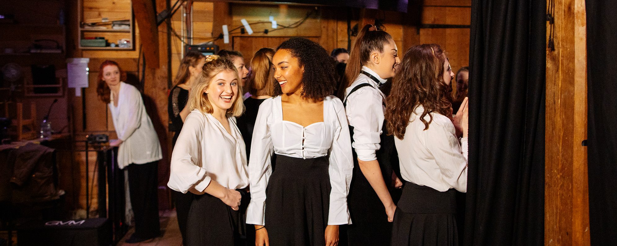 Job Opportunities at Shakespeare’s Globe A group of performers are backstage at a theatre ready to go on stage