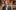 Neil Constable Shakespeare's Globe Simon Kane WEB A man wearing a suit sits in the Globe Theatre, smiling to camera.