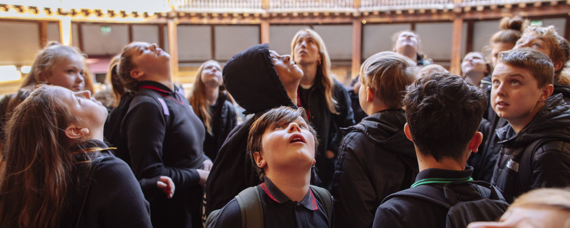 new-header-for-schools-and-teachers-landing-page-scaled-aspect-ratio-2000-800 Group of school children in the Globe, gazing up in awe