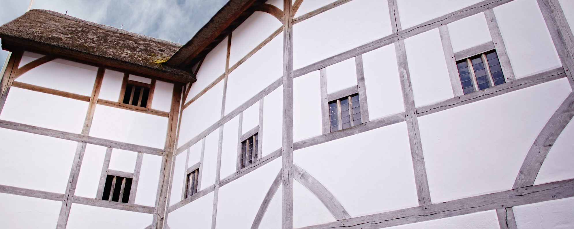 Our Story A close up of a white timber framed building