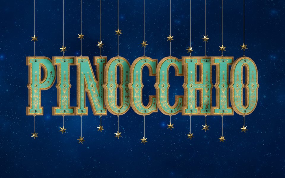 Green and yellow letters spelling 'Pinocchio' hang down from string in front of a night sky.