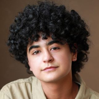 This is a headshot of Roman Asde looking directly to camera.