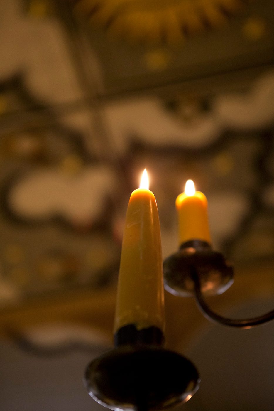 Sam Wanamaker Playhouse Pete Le May Two candles sit on a black candelabra