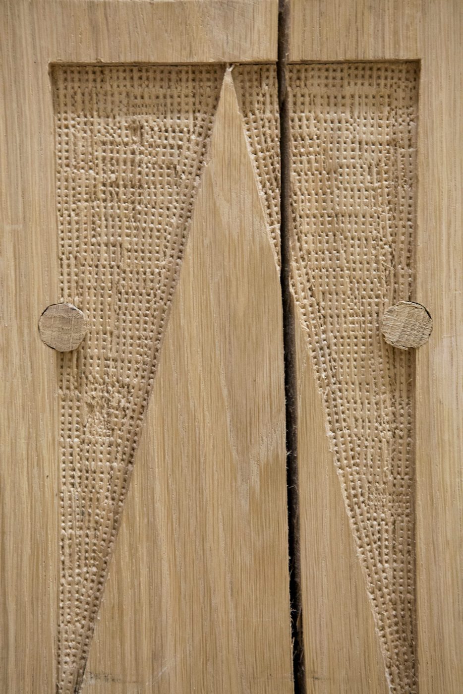 Sam Wanamaker PlayhoSam Wanamaker Playhouse Pete Le Mayuse A close up of a wooden material with textured patterns carved into it