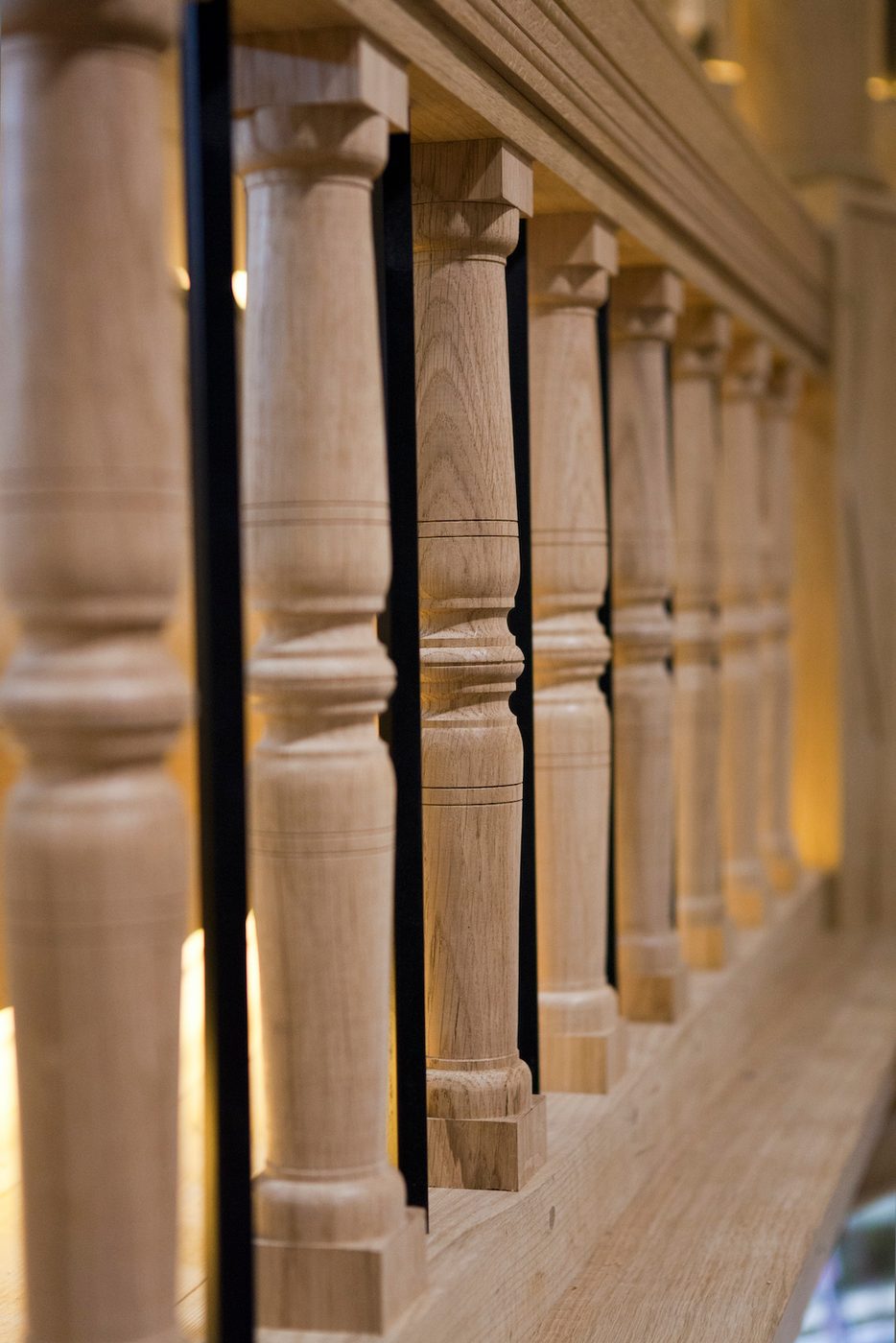 Sam Wanamaker Playhouse Pete Le May A close up of the wooden bars that line a gallery of a stage