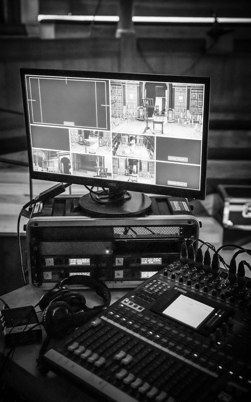 Sam Wanamaker Playhouse Studio A monochrome image of recording equipment and a screen showing different camera angles