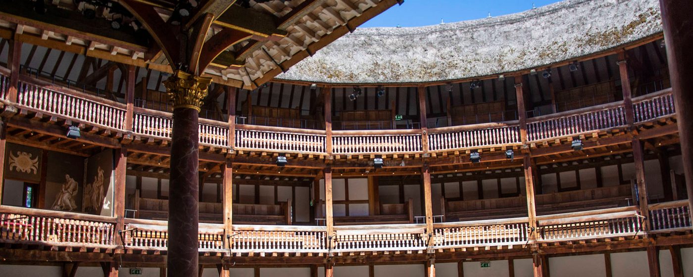 Shakespeare's Globe Culture Recovery Fund Sunlight streams into the yard of a wooden circular theatre.