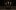 Spooky stories three candles Three lit candles in the dark shadows of an indoor wooden theatre.