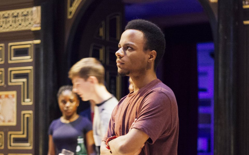 A young person taking part in an on-stage workshop.