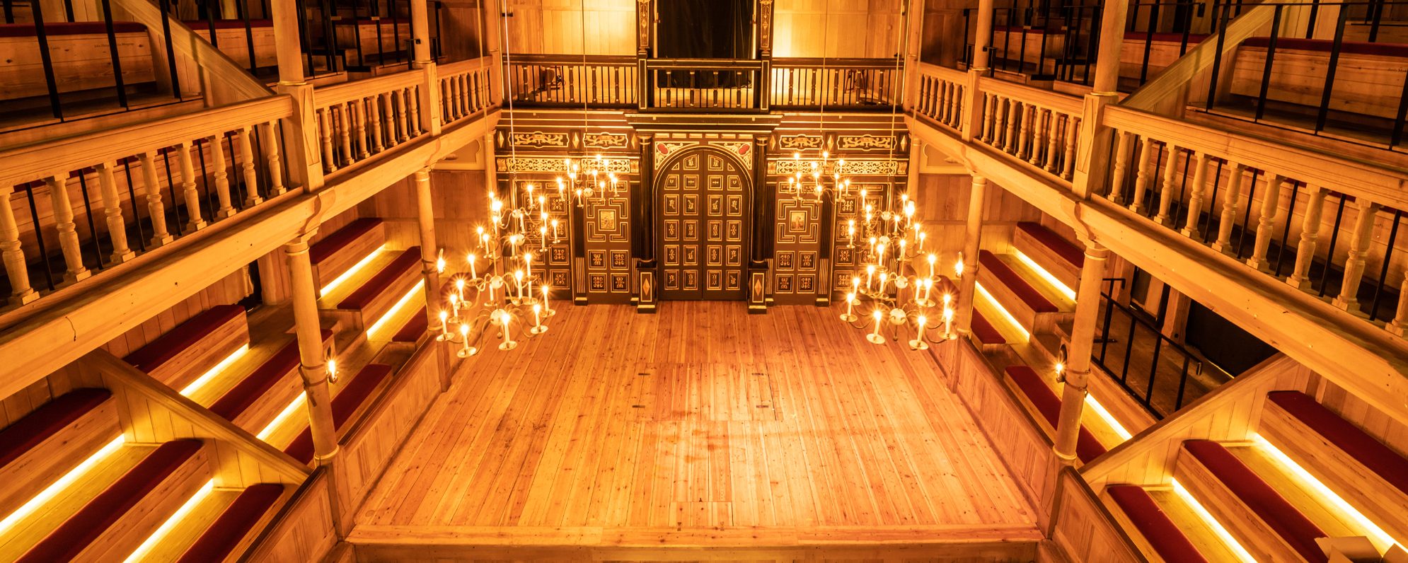 Venue Hire and Corporate Opportunities Masthead Empty stage with lit candels