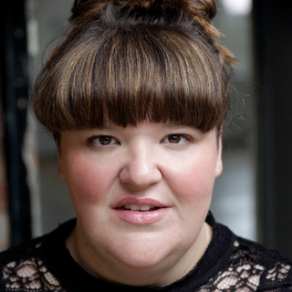 This is a headshot of Jamie-Rose Monk looking directly into camera.
