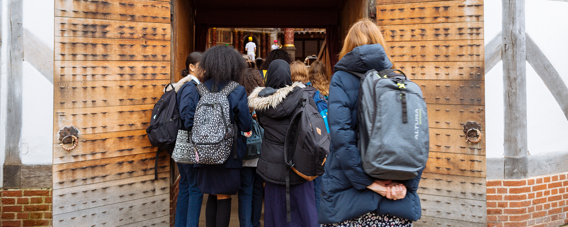 Risk assessment and COVID-19 advice for schools A school group walking into the yard of the Globe Theatre